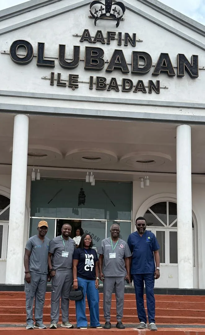 Group of people standing on the steps of the Aafin Olubadan building